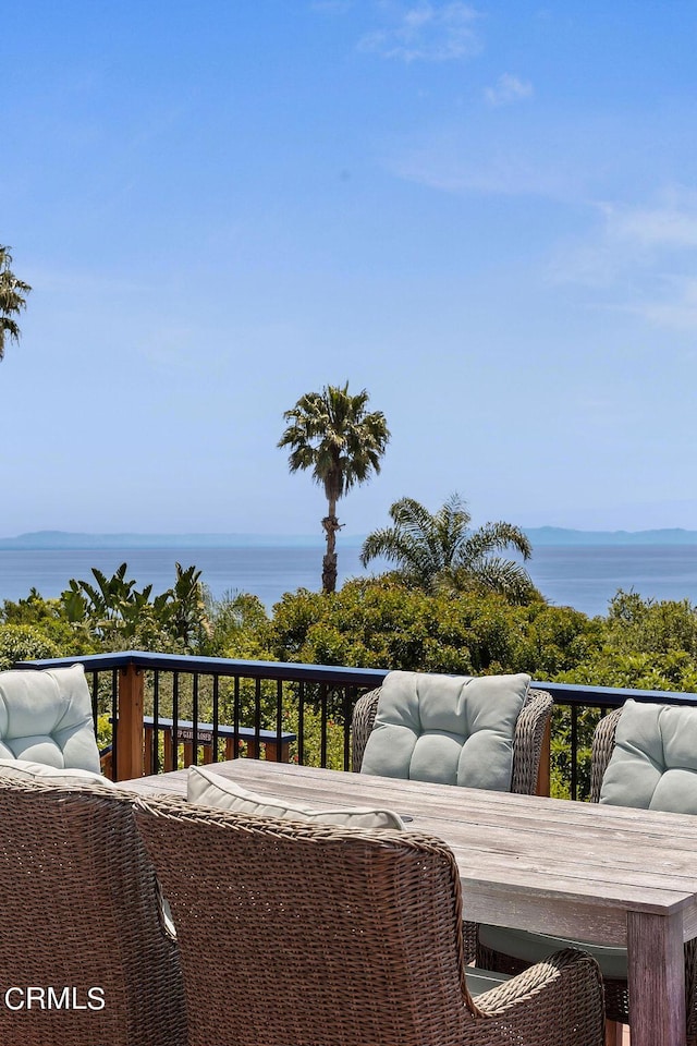 balcony featuring a water view