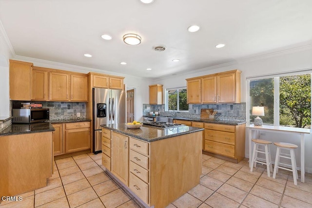 2335 Whitney Ave, Summerland, CA 93067 - kitchen with visible vents, light tile patterned floors, stainless steel appliances, decorative backsplash, and a kitchen island