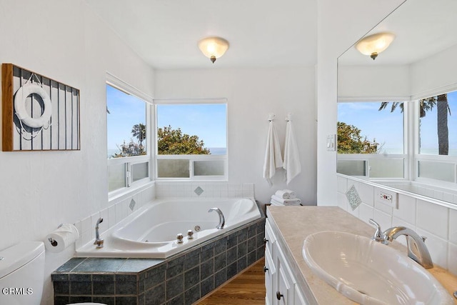 2335 Whitney Ave, Summerland, CA 93067 - bathroom featuring vanity, wood finished floors, toilet, and a tub with jets