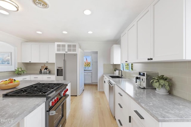 2335 Whitney Ave, Summerland, CA 93067 - kitchen featuring decorative backsplash, visible vents, a sink, and appliances with stainless steel finishes
