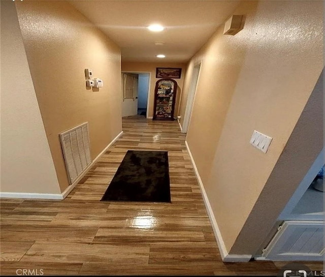 corridor featuring hardwood / wood-style flooring