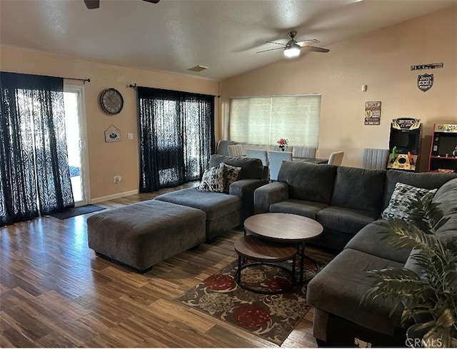 living room with ceiling fan, wood-type flooring, and lofted ceiling