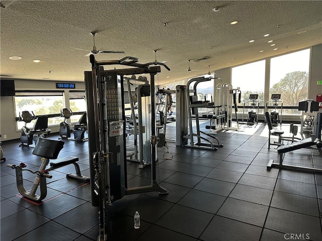 workout area featuring a textured ceiling