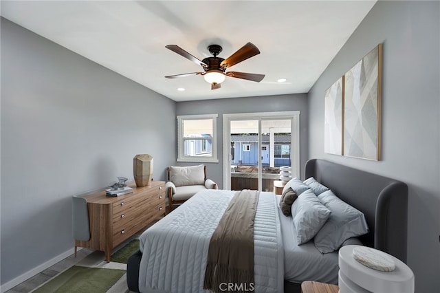 bedroom featuring ceiling fan and access to exterior