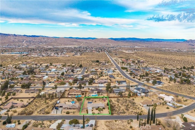 birds eye view of property featuring a mountain view