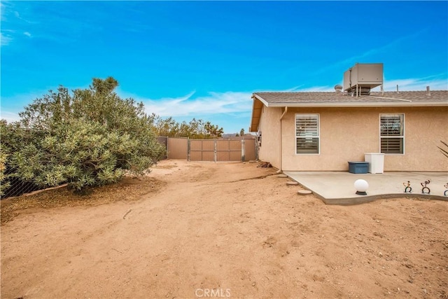 view of side of home featuring a patio