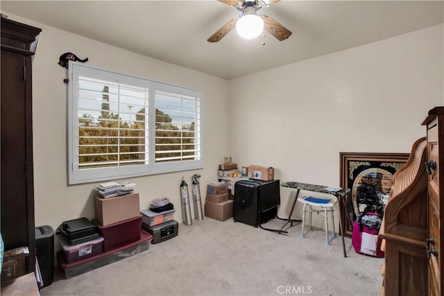 miscellaneous room featuring ceiling fan and light colored carpet