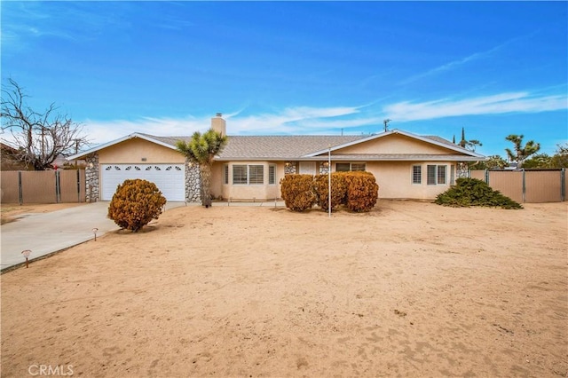 ranch-style house featuring a garage