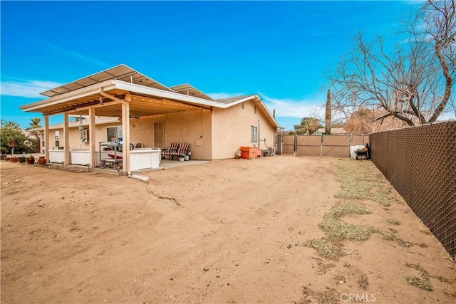 rear view of house featuring a patio