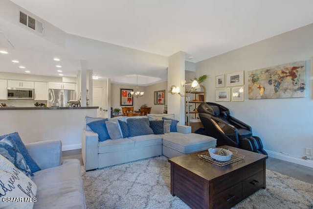 living room with an inviting chandelier