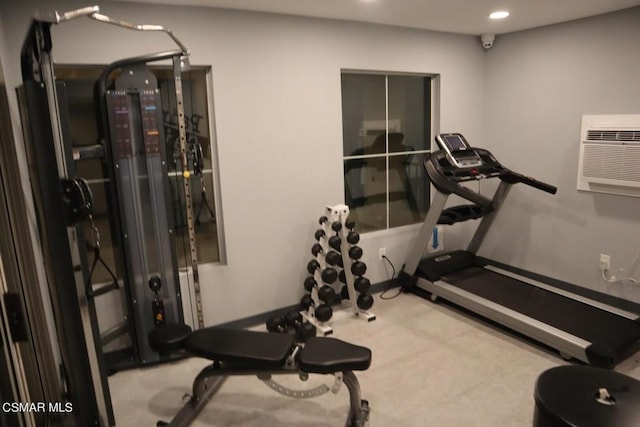 exercise area featuring a wall mounted air conditioner