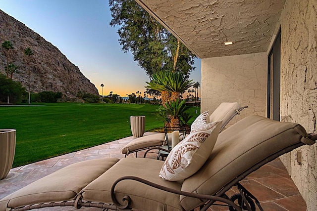 patio terrace at dusk with a yard