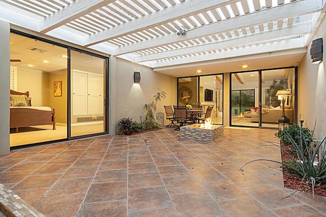 view of patio with a fire pit and a pergola