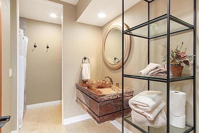 bathroom with vanity and tile patterned flooring