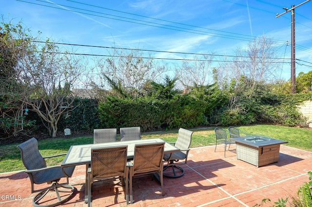 view of patio / terrace featuring an outdoor fire pit