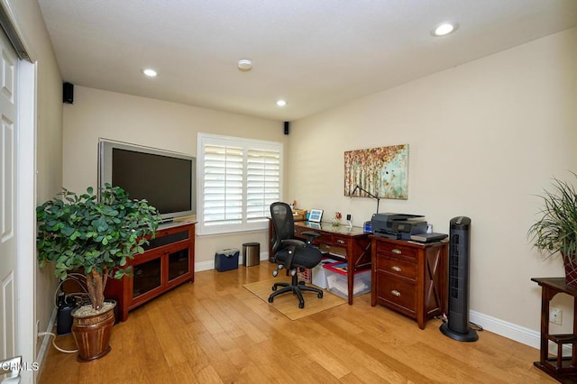 office with light hardwood / wood-style floors