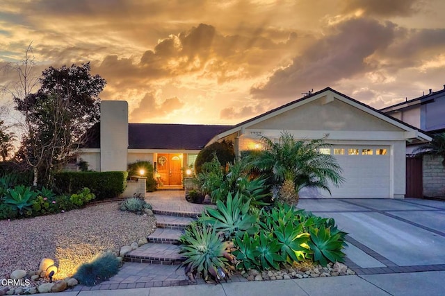 ranch-style home featuring a garage