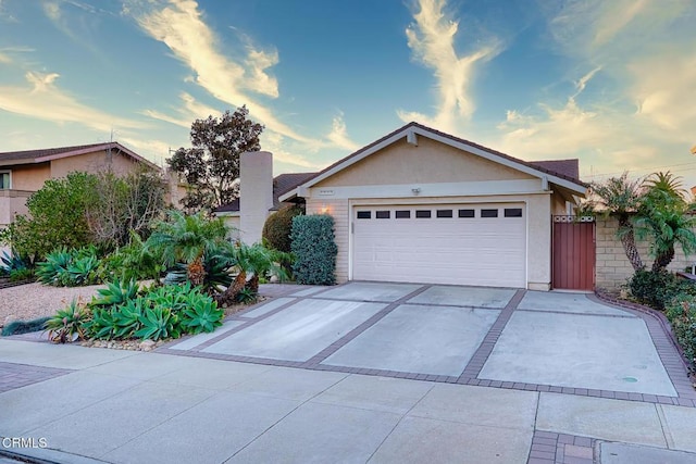 single story home featuring a garage