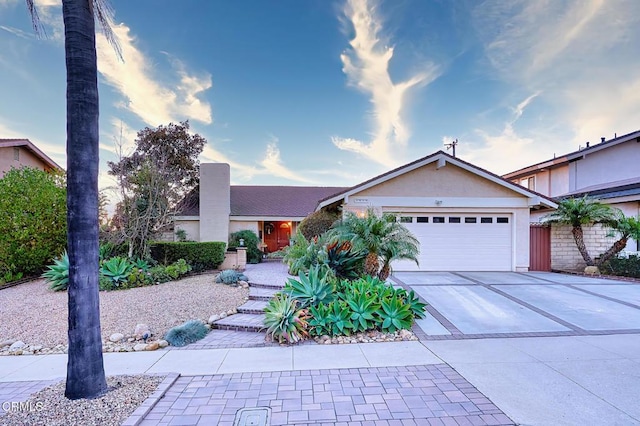 single story home with a garage