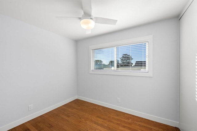 spare room with ceiling fan and wood-type flooring