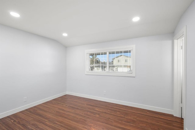 unfurnished room with dark wood-type flooring