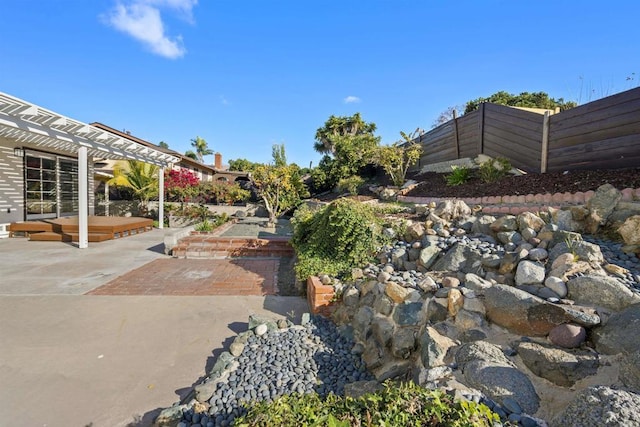 view of yard with a pergola and a patio