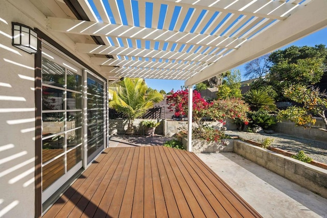 deck with a pergola and a patio