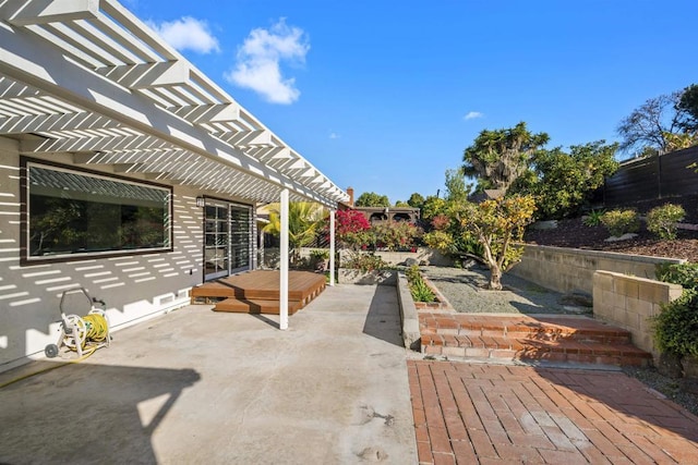 view of patio / terrace with a pergola and a deck