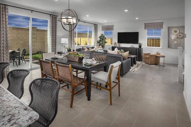 dining room with a healthy amount of sunlight and an inviting chandelier