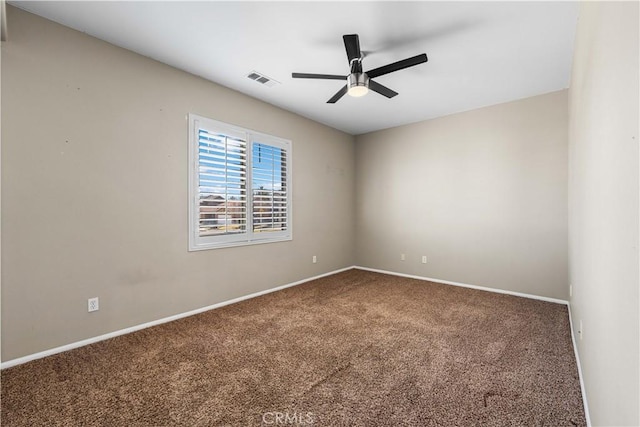 carpeted empty room with ceiling fan