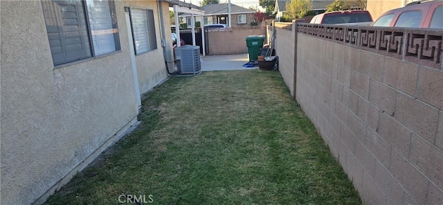 view of yard featuring central AC