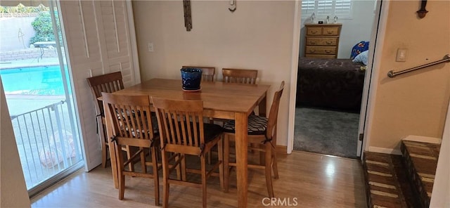 dining space featuring light wood-type flooring