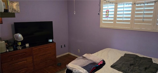 bedroom featuring wood-type flooring