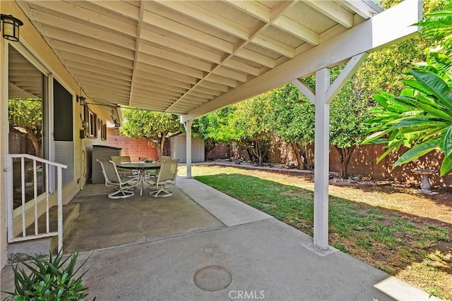 view of patio / terrace featuring a shed