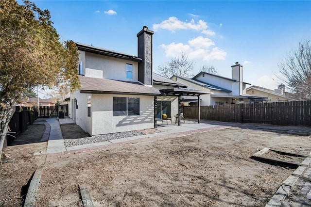 rear view of property with a patio