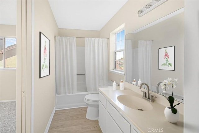 full bathroom featuring toilet, shower / tub combo, vanity, and hardwood / wood-style flooring