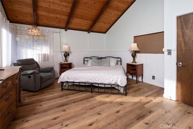 bedroom with wood ceiling, light hardwood / wood-style floors, and vaulted ceiling with beams