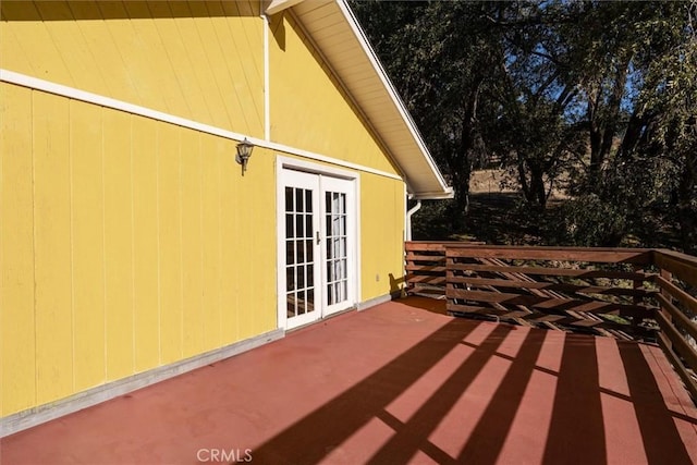 view of patio featuring a deck and french doors