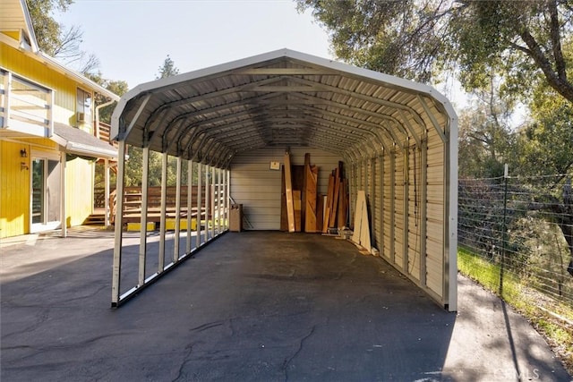 view of parking / parking lot featuring a carport