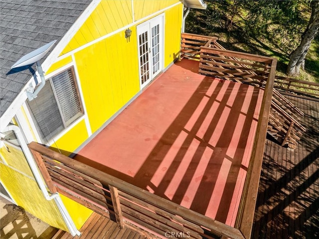 exterior space with a wooden deck and french doors