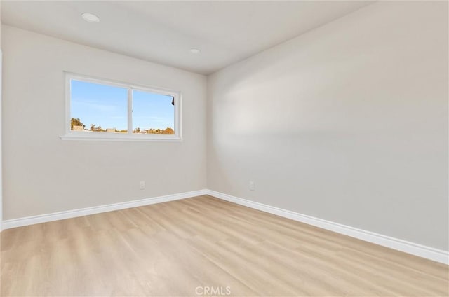 unfurnished room featuring light hardwood / wood-style flooring