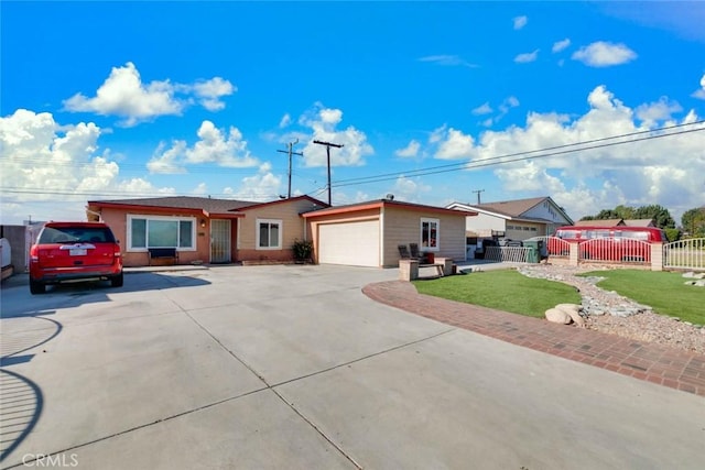 ranch-style house with a garage and a front yard