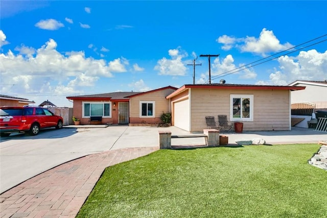 exterior space with a front yard and a garage