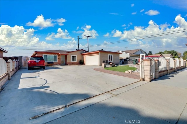 view of front of house featuring a garage and a front yard