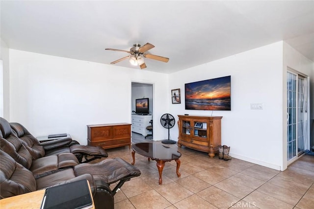 tiled living room with ceiling fan