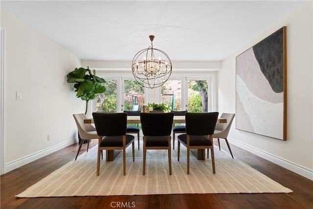 dining room with a notable chandelier and hardwood / wood-style flooring