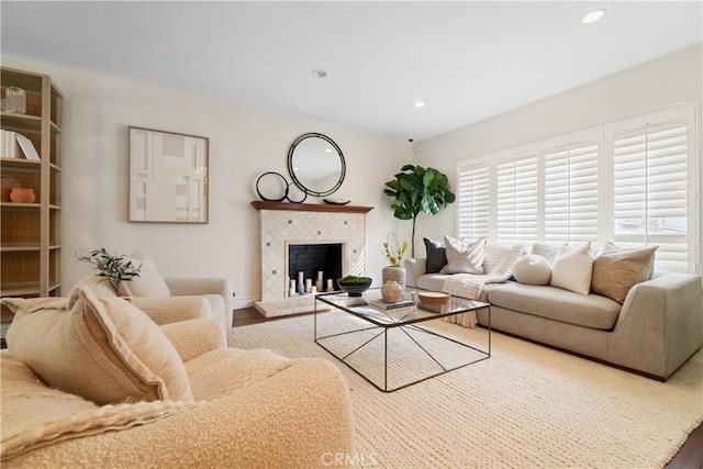 living room with a fireplace and hardwood / wood-style flooring