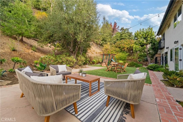 view of patio with an outdoor hangout area and a playground