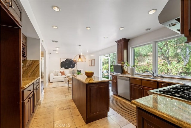 kitchen featuring a center island, light tile patterned flooring, dishwasher, hanging light fixtures, and sink