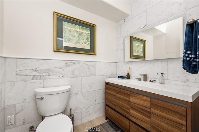 bathroom with toilet and vanity